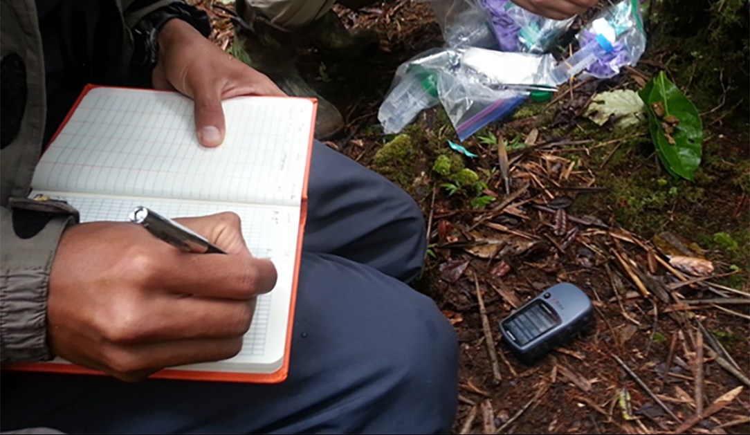 Noting GPS Coordinates of the wildlife groups. Photo: Sabrina Szeto.